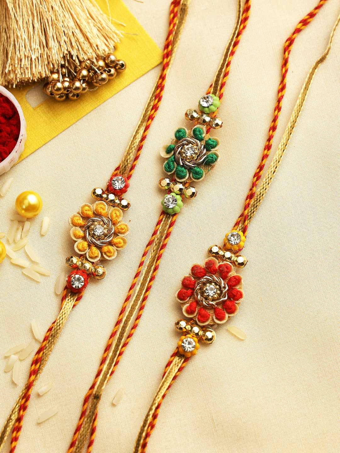 Beautiful Thread-Word and Gold Beads Rakhi Set of Three - Only Rakhi (PST22708_3)