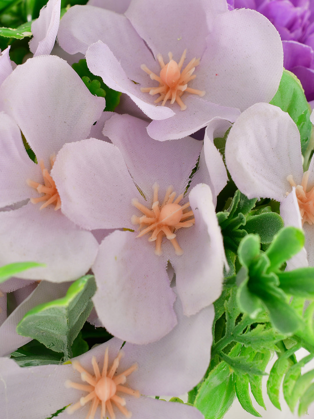 Artificial Flowers In A Diamond Pattern Planter