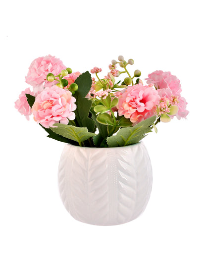 Artificial Pink Flowers with a White Textured Planter