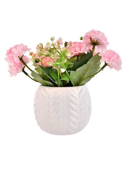 Artificial Pink Flowers with a White Textured Planter