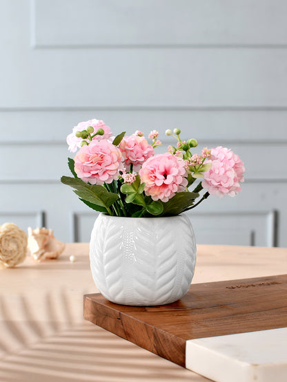 Artificial Pink Flowers with a White Textured Planter