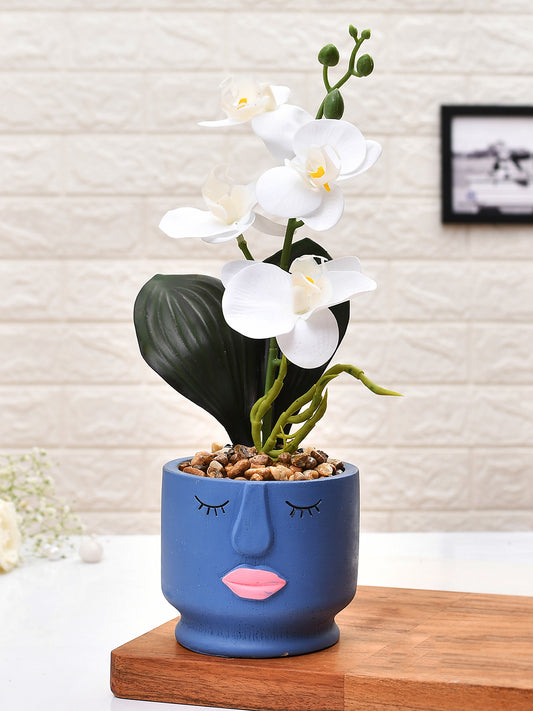 Artistic Blue Face Planter with White Artificial Orchids