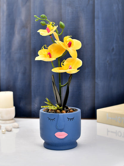 Artistic Blue Face Planter with Yellow Artificial Orchids