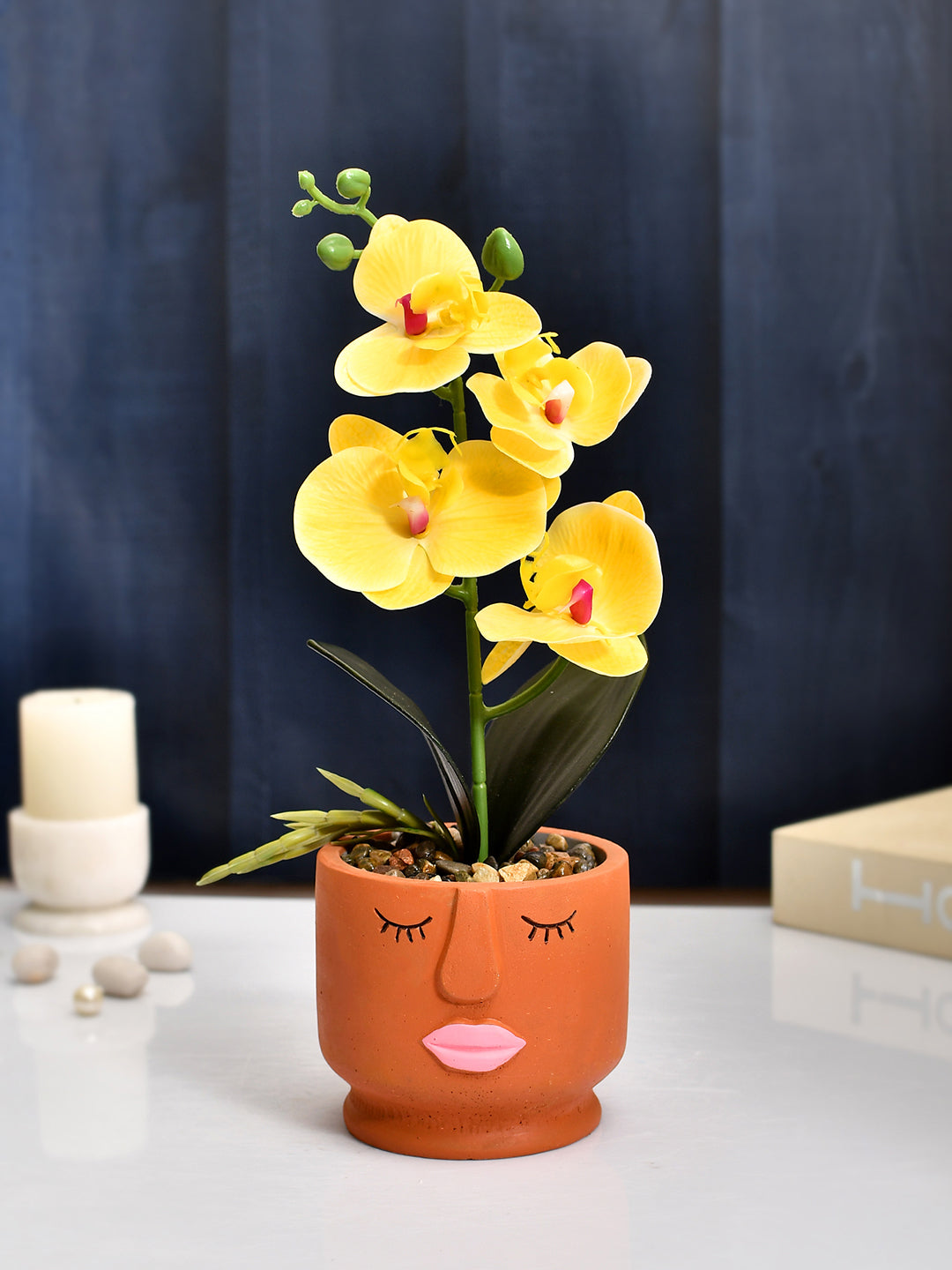 Artistic Orange Face Planter with Yellow Artificial Orchids