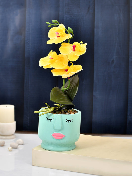 Artistic Blue Face Planter with Yellow Artificial Orchids