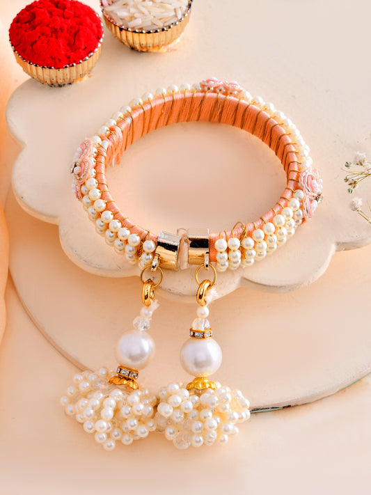 Soft Peach Pearl Bracelet Rakhi for Bhabhi with Dual Latkan Drops