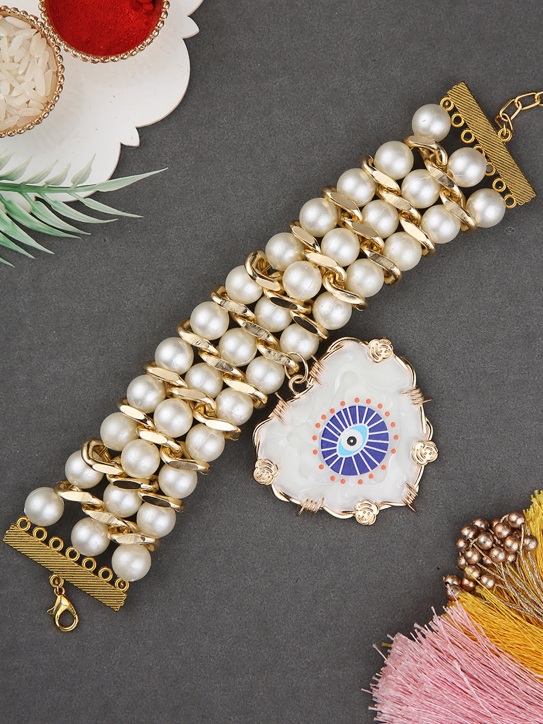 Luxury Ladies Bracelet Rakhi With Layered Pearls And Crystal Evil Eye Motif