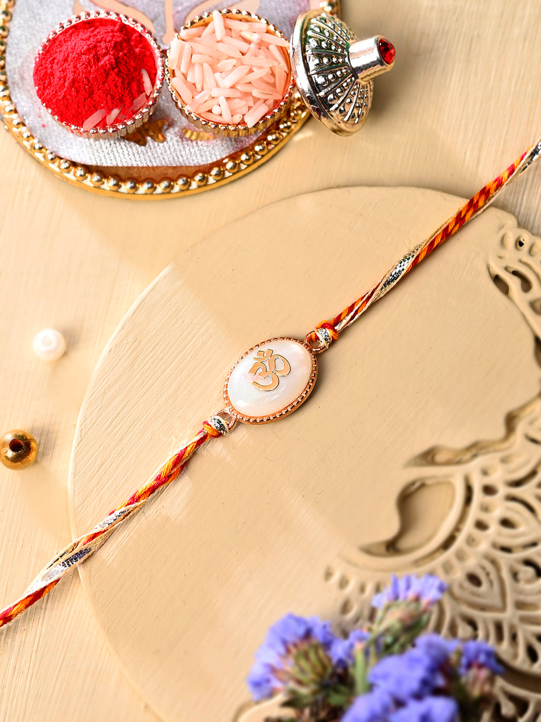 Auspicious OM Patterned White Stone Rakhi