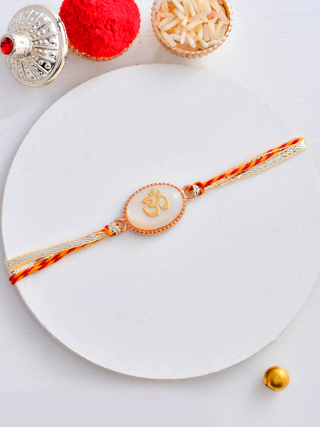 Auspicious OM Patterned White Stone Rakhi