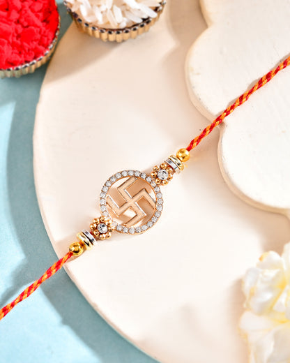 Swastik Rakhi with Stone-Studded Round Design and Sacred Thread