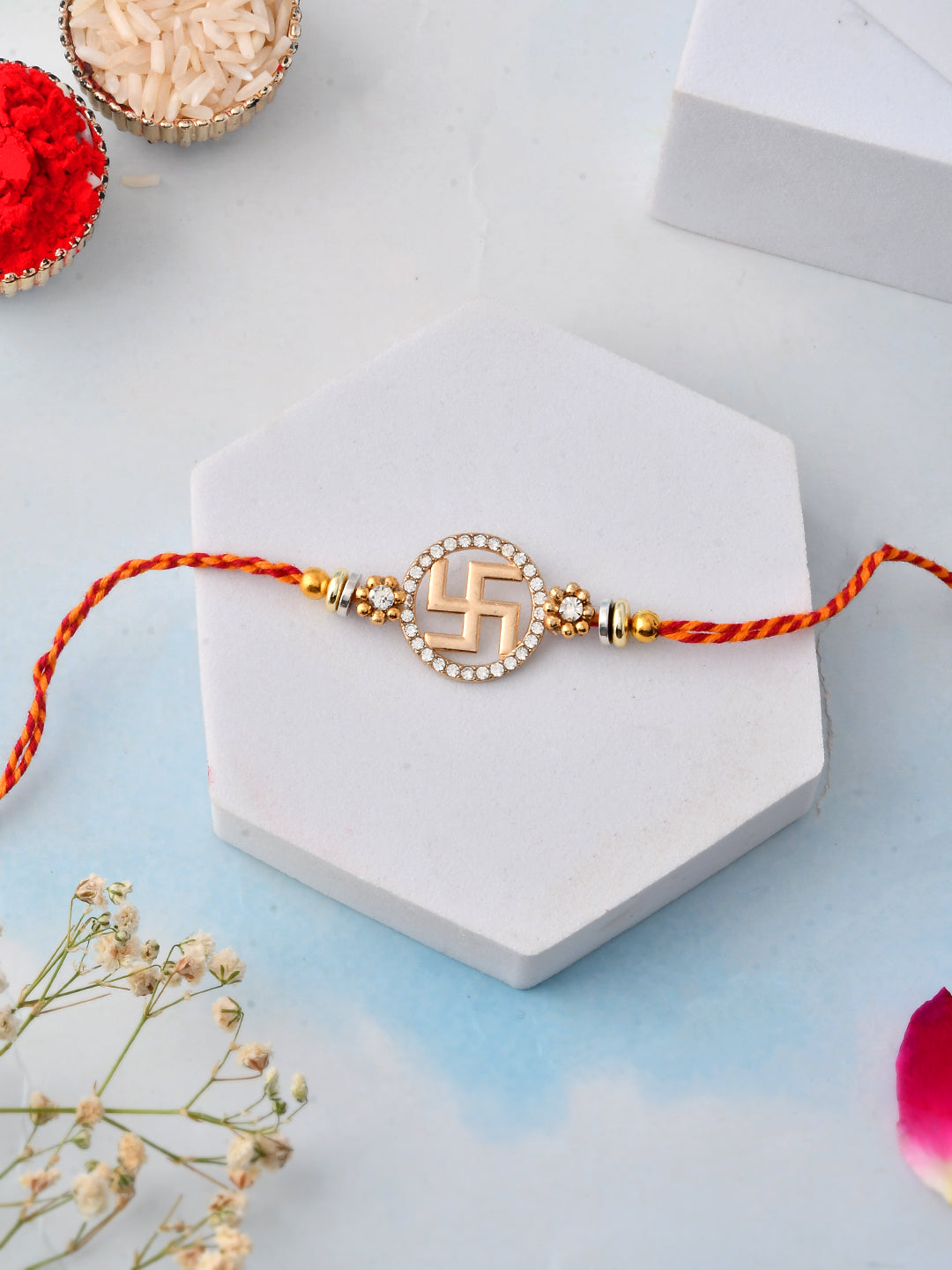 Swastik Rakhi with Stone-Studded Round Design and Sacred Thread
