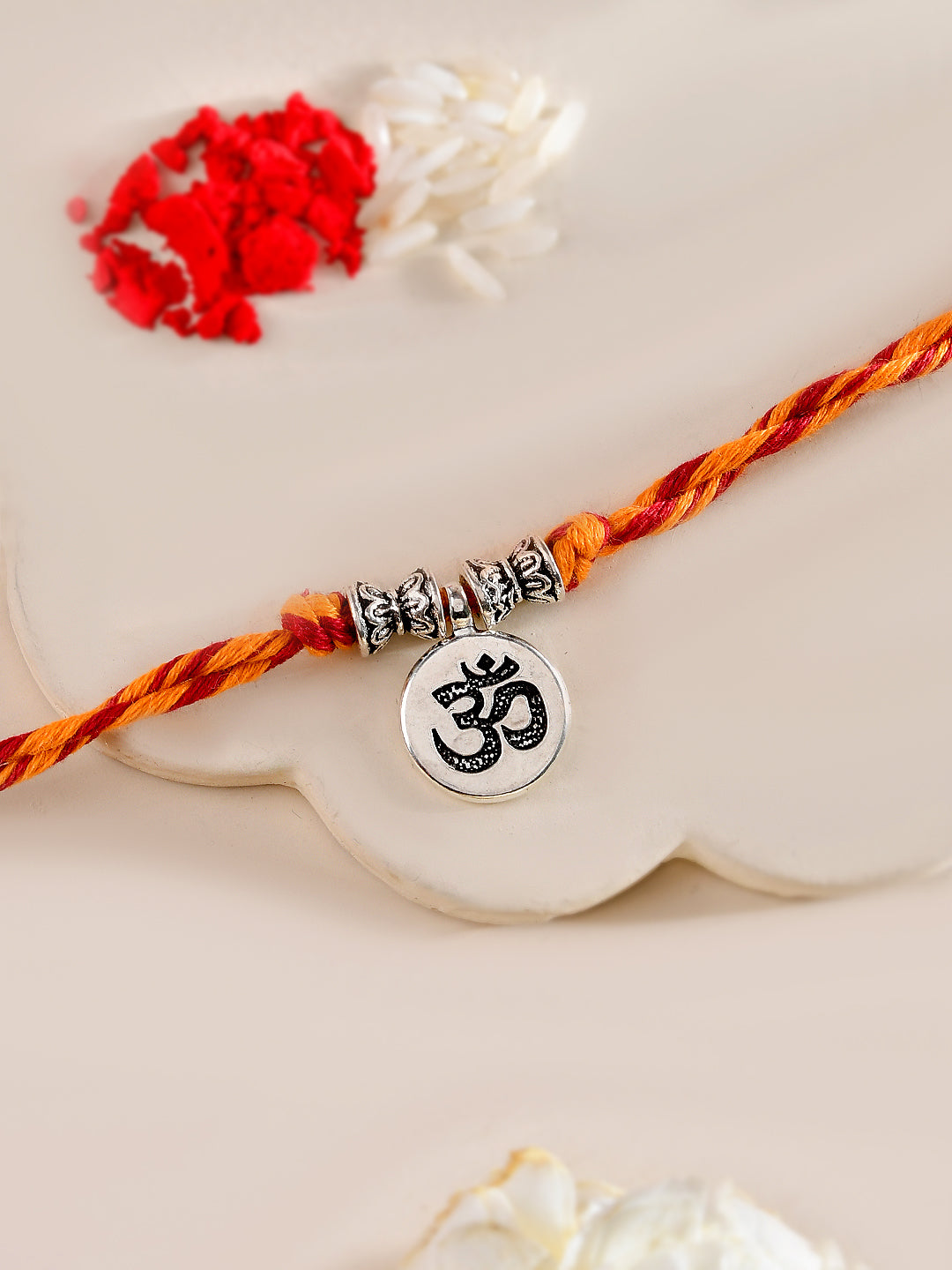 Om Symbol Rakhi with Braided Red Yellow Thread and Silver Charm