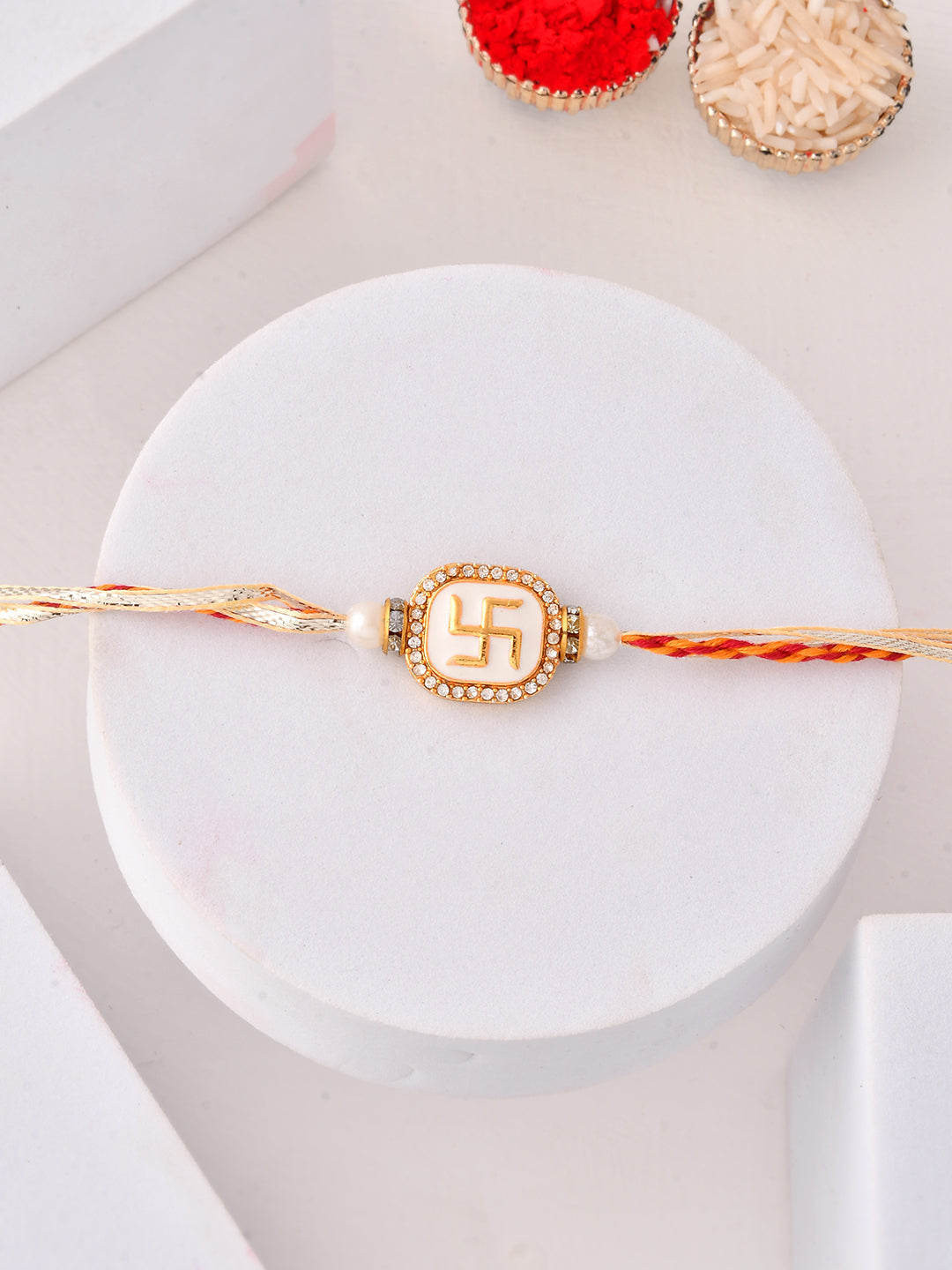 Divine Swastik Rakhi with Pearl Finish and Sacred Vibes