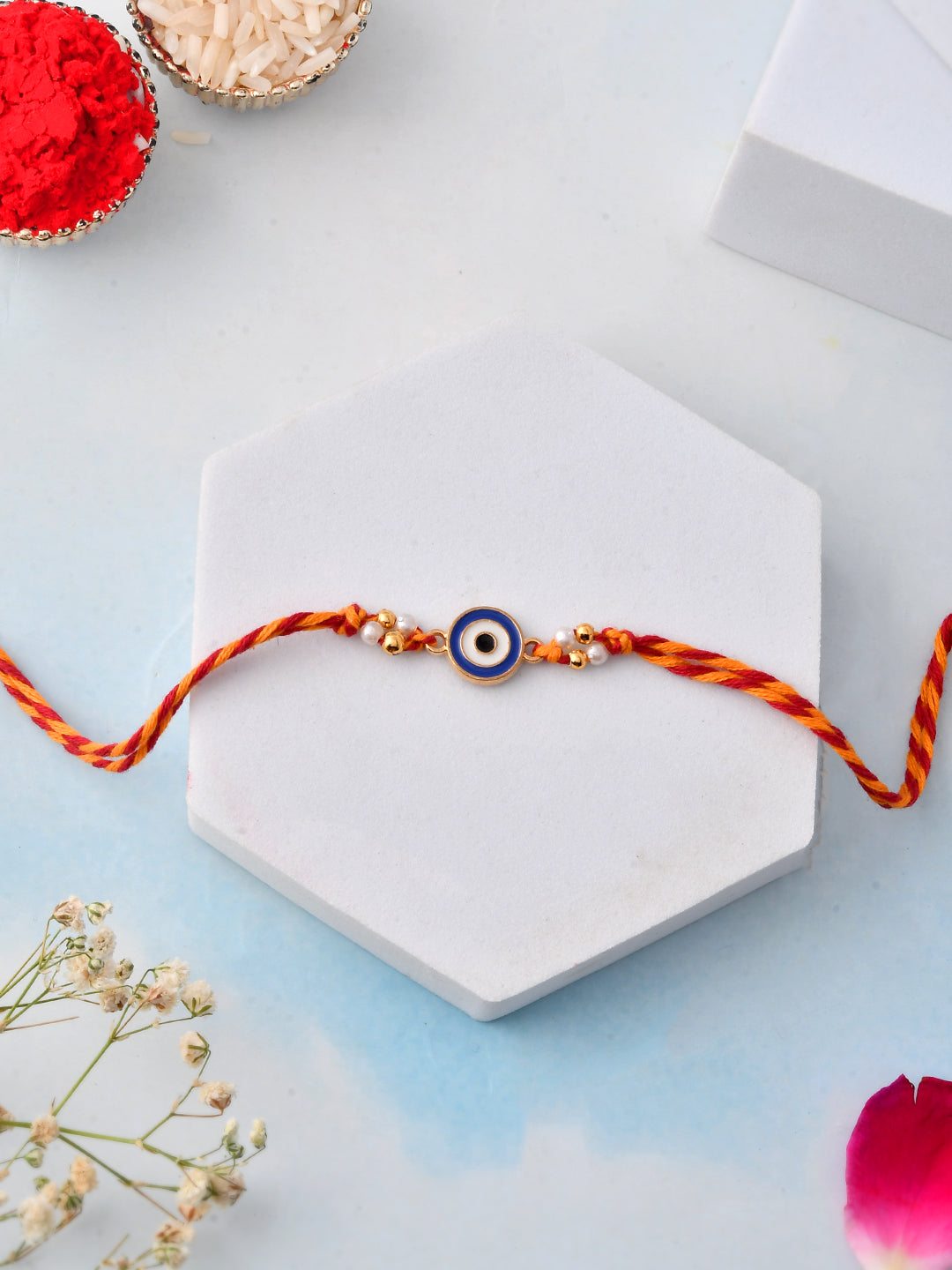 Nazar Raksha Rakhi with Festive Charm and Golden Accents