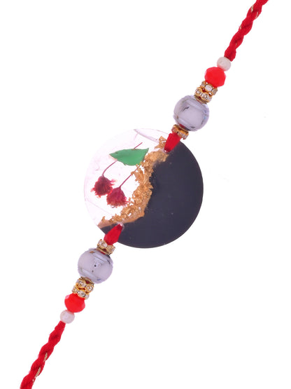 Black & Gold Resin Rakhi with Red Thread and Miniature Garden Scene