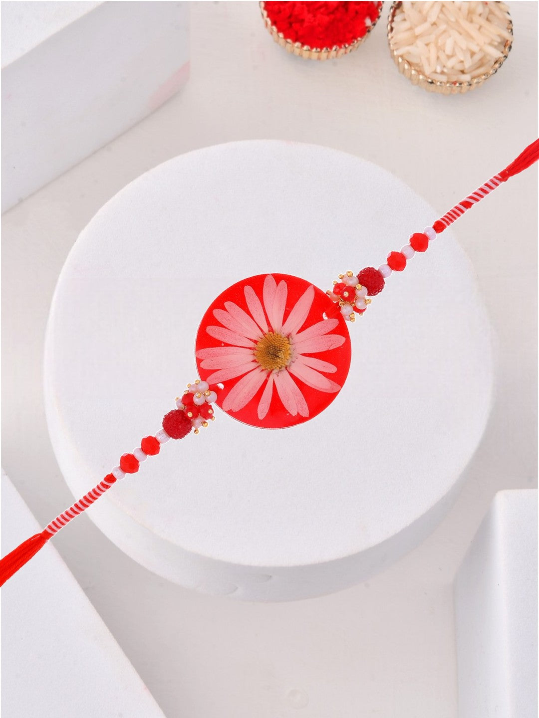 Pressed Real Flower Rakhi in Red Resin
