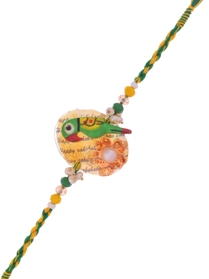 A Rakhi with a colorful parrot motif, featuring beads and a yellow-green thread.