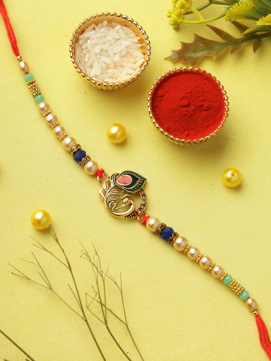 Regal Peacock Feather Pearl Rakhi