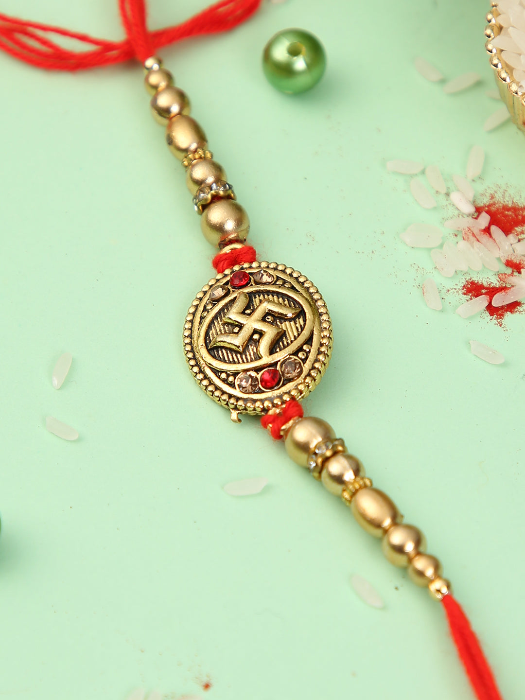 Golden Swastik Pearl Rakhi