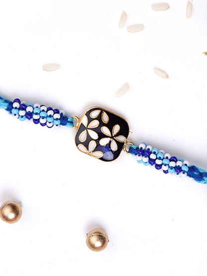 White Flroal Enameled Blue Single Rakhi
