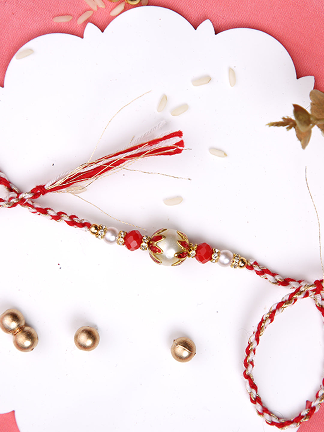 White & Red Twisted Rakhi with a Pearl