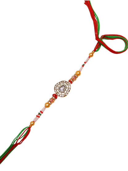 Traditional Handmade Kundan Rakhi With Red Green Mauli And Golden Pearls