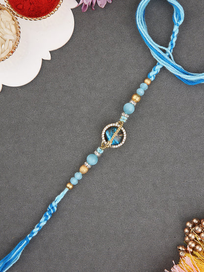 Handcrafted  Floral-Inspired Rakhi with Blue Center Stone and Pastel Beads