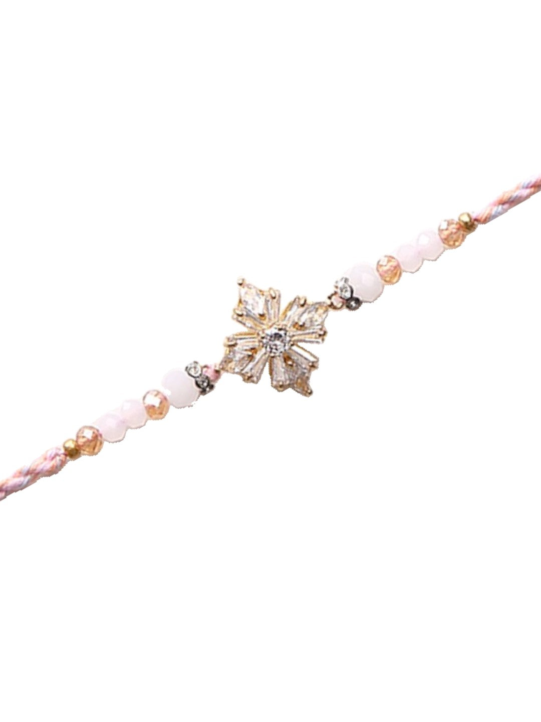 A minimalistic yet elegant Rakhi featuring a floral or star-shaped central piece with pastel