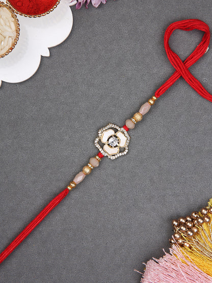 Traditional Handmade Flower Rakhi with Pearl Accents and Golden Touch
