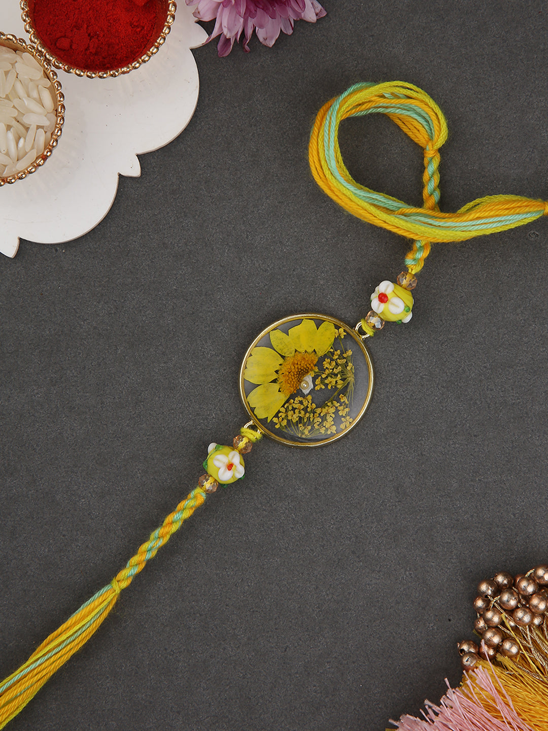 Ethnik Yellow Flower Rakhi With Resin Centerpiece And Braided Handmade Dori