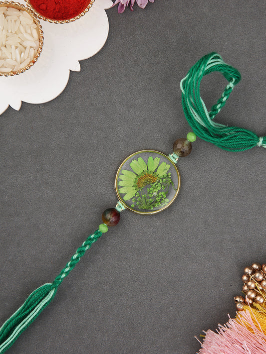 Nature Inspired Green Resin Rakhi With Leafy Motif And Silk Thread Accent