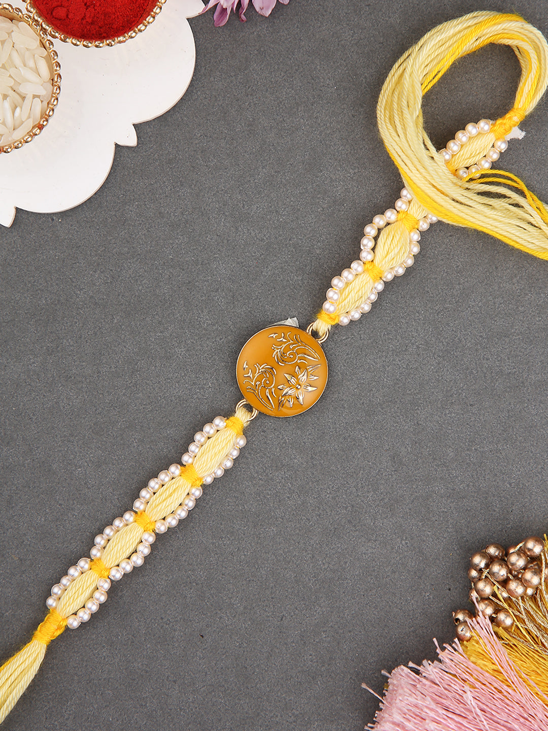 Handcrafted Yellow Thread Rakhi with Intricate Floral Center Design