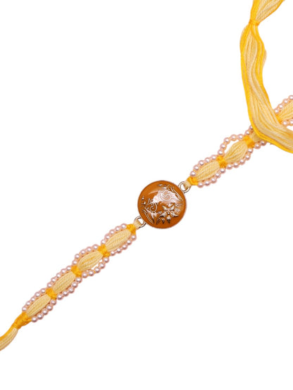 Handcrafted Yellow Thread Rakhi with Intricate Floral Center Design