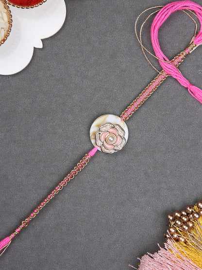 Ethnic Rakhi with Pearl-Studded Lotus Design and Soft Tones