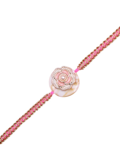 Ethnic Rakhi with Pearl-Studded Lotus Design and Soft Tones