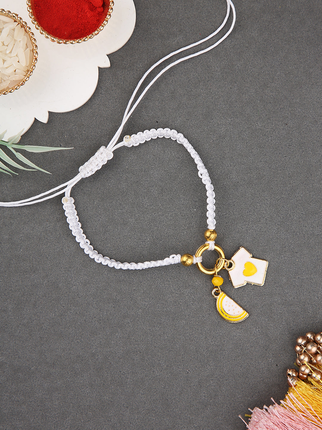 White Charm Bracelet Rakhi with Gold-Plated Heart and Star Accents