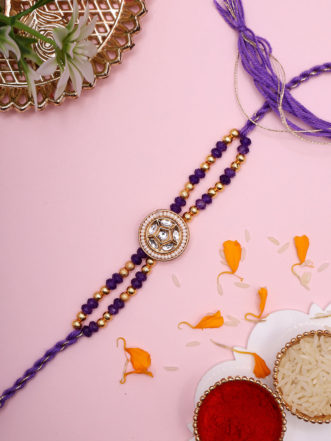 Elegant Dual-Strand Rakhi with Crystal Floral Center in Royal Purple