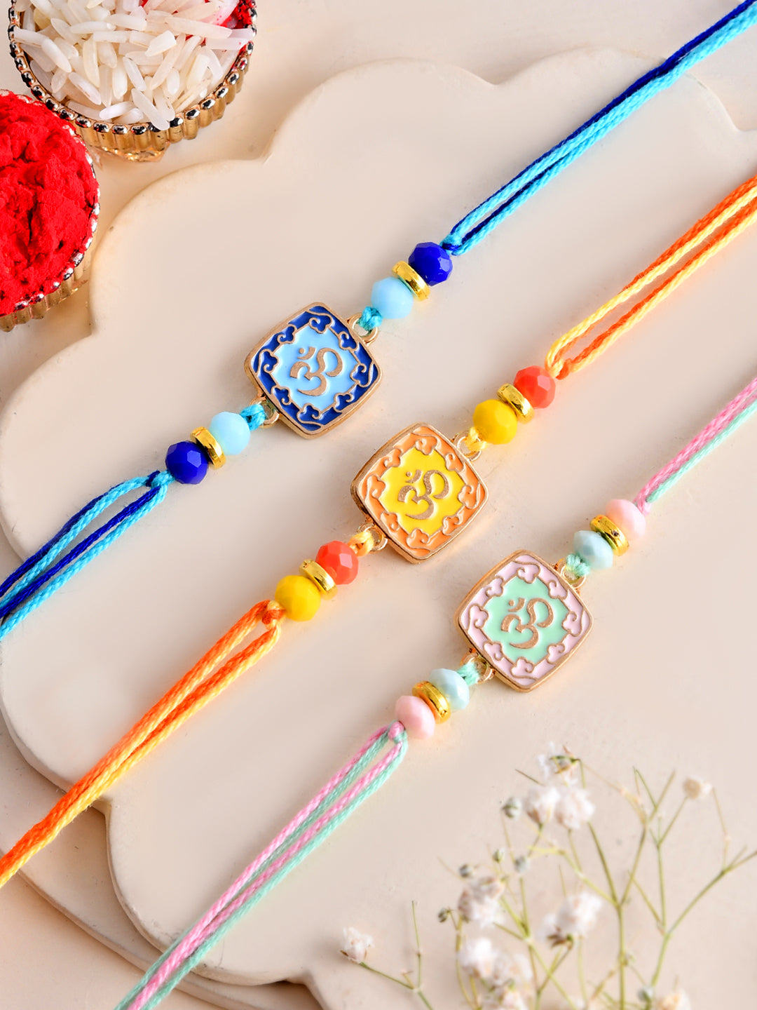 Handcrafted Om Symbol Rakhi Set of 3 in Festive Pastel Shades