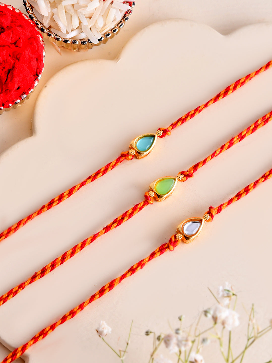 Subtle Kundan Rakhi Set of 3 with Teardrop Stone Design