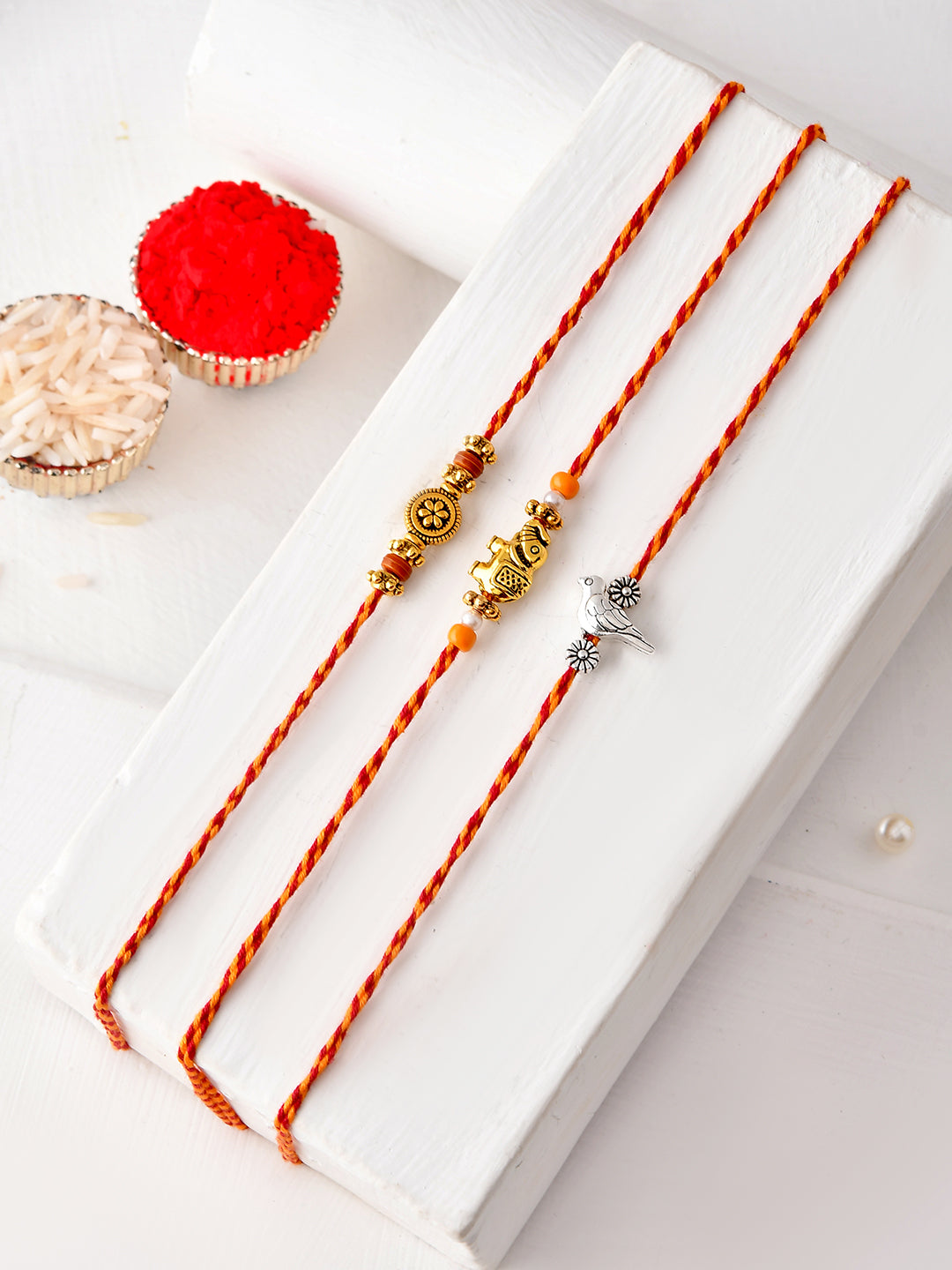 Festive Rakhi Set of 3 with Elephant Fish and Floral Motifs