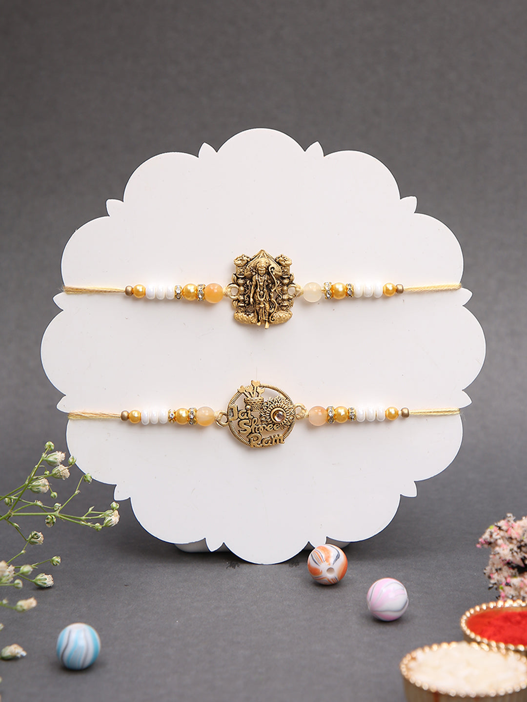 Antique God Symbol Rakhi Set with Divine Detailing and Pearl Beads