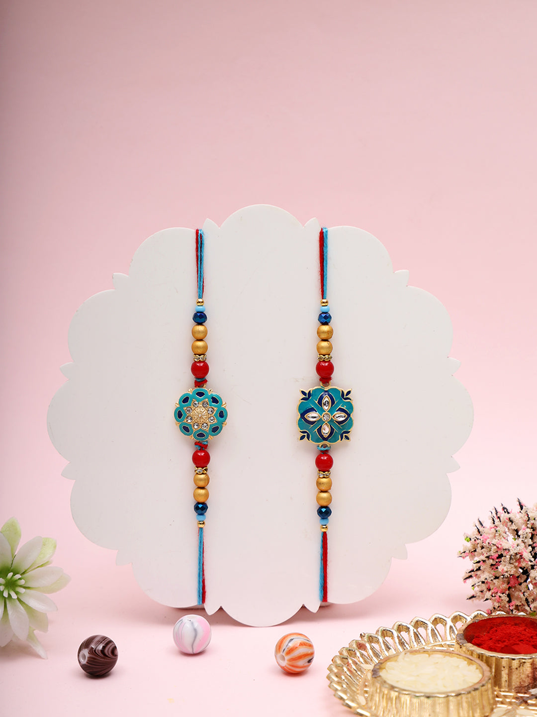 Elegant Designer Rakhi Set with Enamel Floral Motif and Blue Thread Accents
