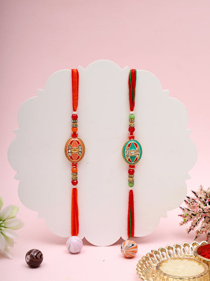 Graceful Rakhi Pair with Intricate Enamel and Threadwork