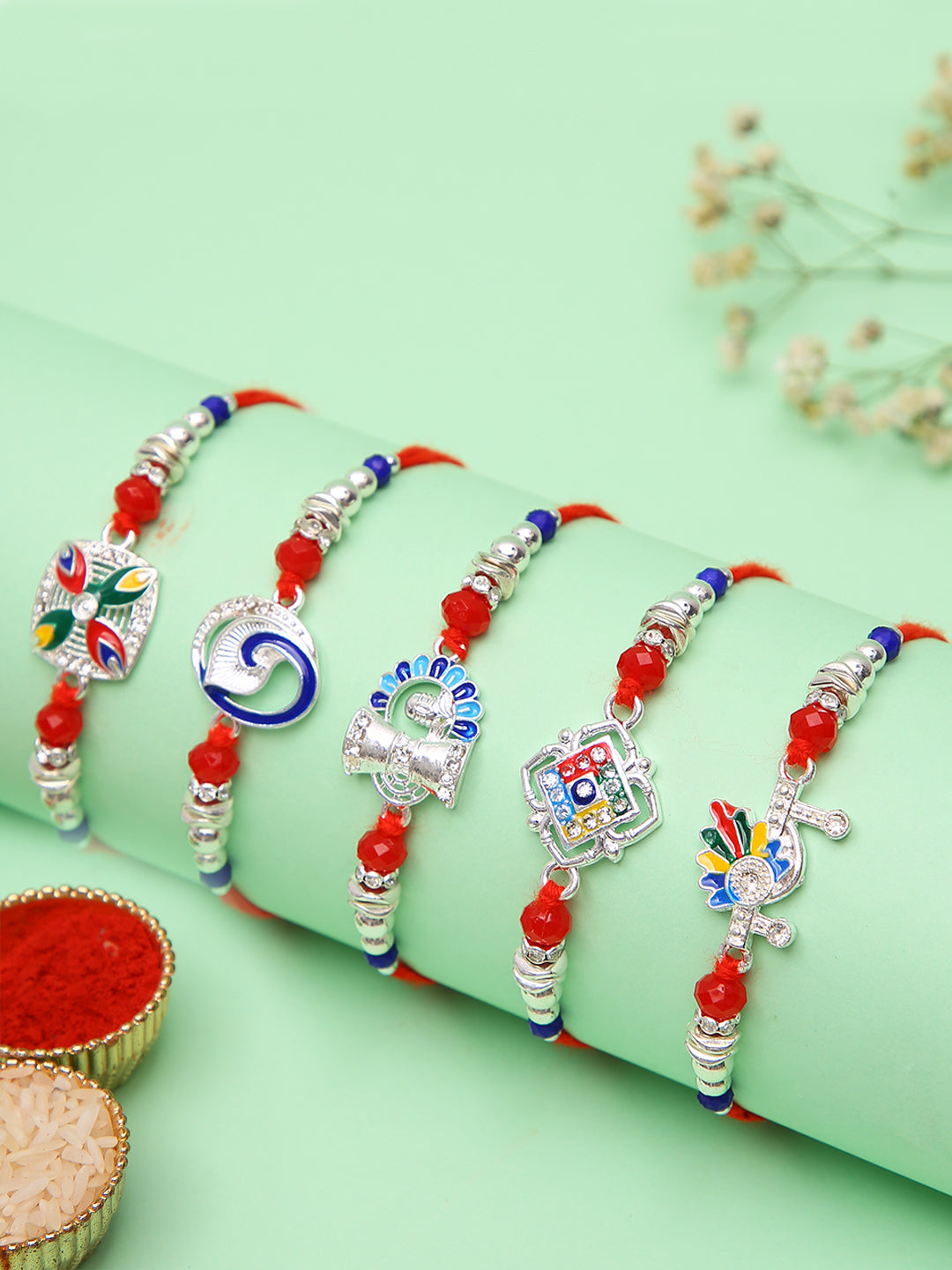 Traditional Rakhi Set Of 5 With Silver Plated Charms And Ethnic Motifs