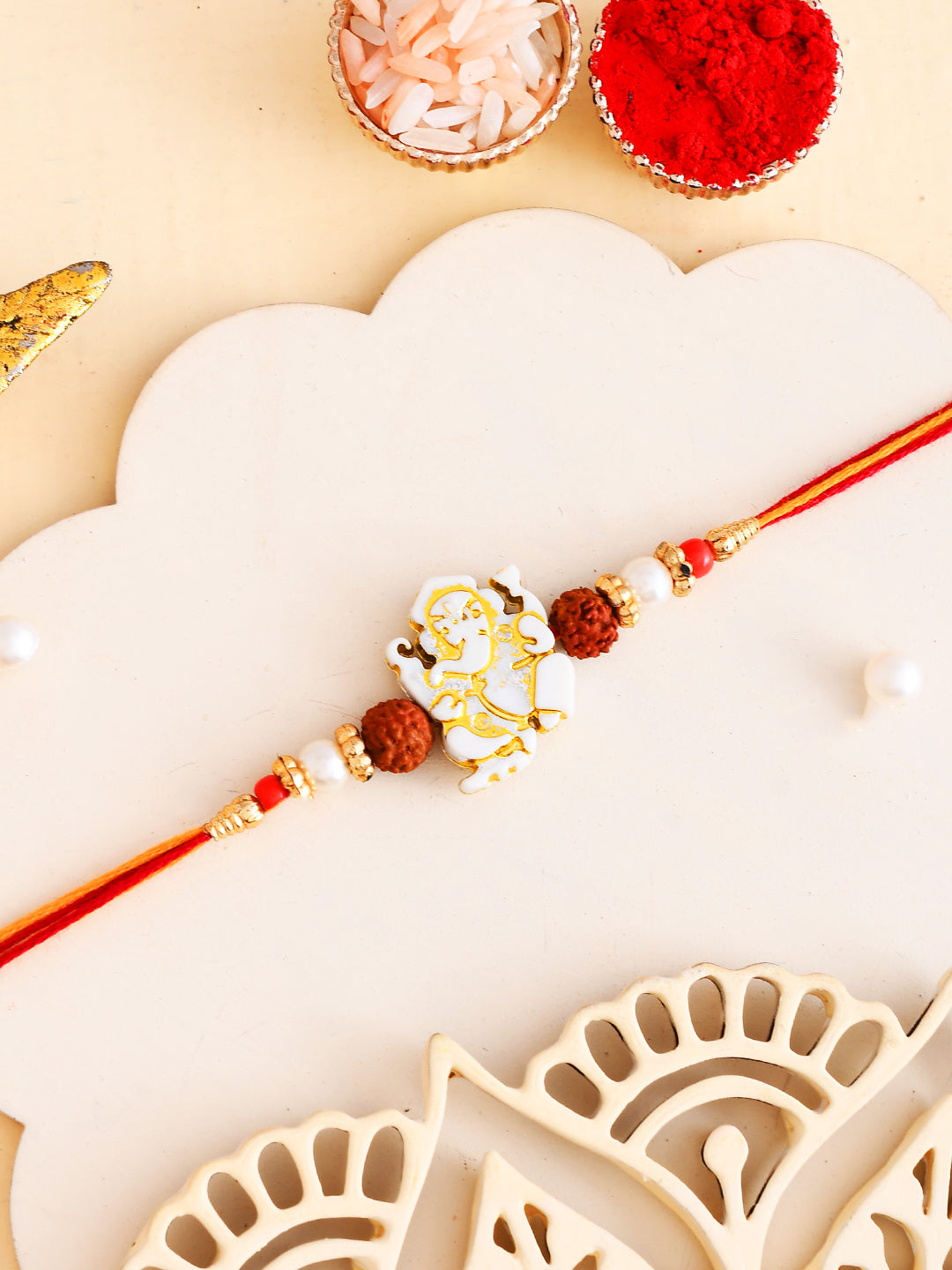 White & Golden Beads Ganesh Motif Rakhi