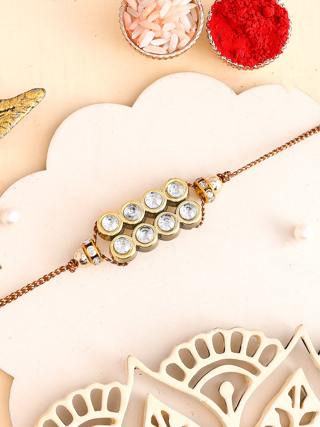 Antique Finish Rakhi with American Diamonds
