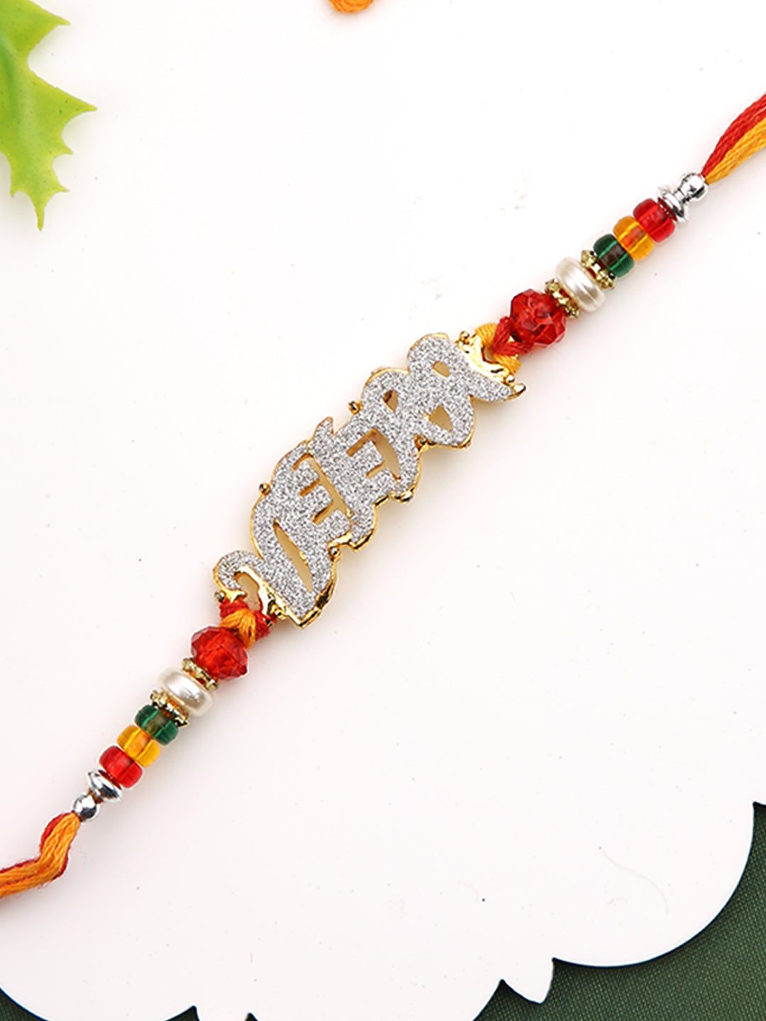 Beautiful AD stud VEERA Rakhi with Golden Beads
