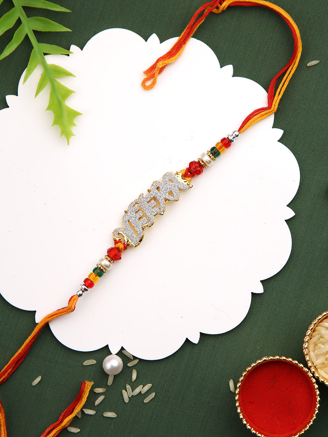 Beautiful AD stud VEERA Rakhi with Golden Beads