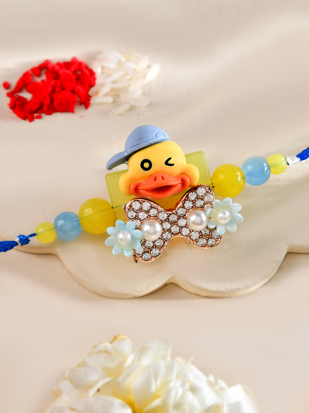 Winking Duck Kids Rakhi with Blue Cap and Crystal Bow Tie