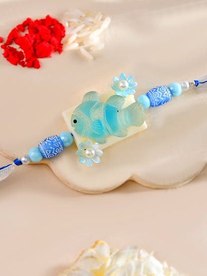 Aqua Fish Kids Rakhi with Blue Beads and Pearl Flowers